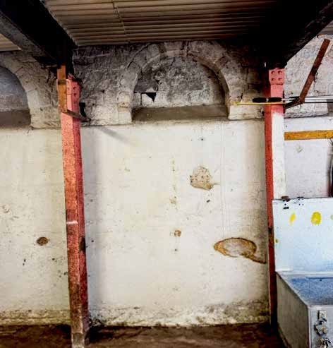 Hidden arches revealing earlier routes through the stables